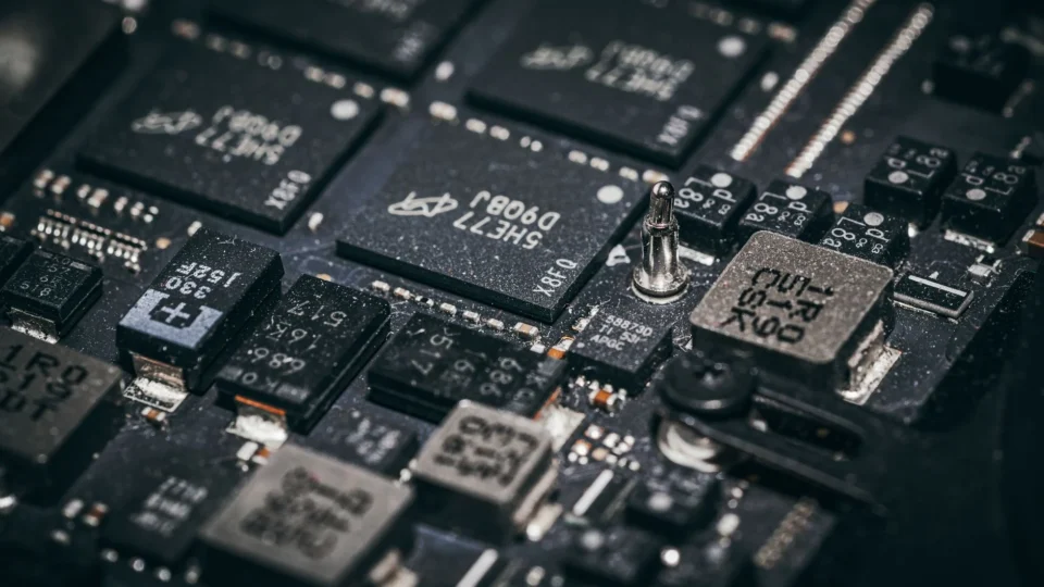 Detailed close-up of electronic microchips on a circuit board, showcasing technology and engineering intricacies.