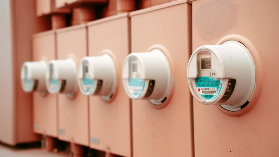 Close-up view of a row of industrial electricity meters for power monitoring and technology.