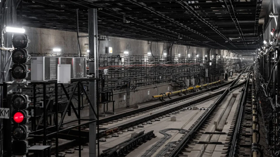 Moscow subway tunnel featuring concrete infrastructure and railway tracks, showcasing urban transit technology.