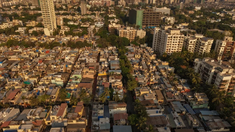 Aerial panorama of Mumbai's diverse architecture showcasing urban skyscrapers and dense residential areas.