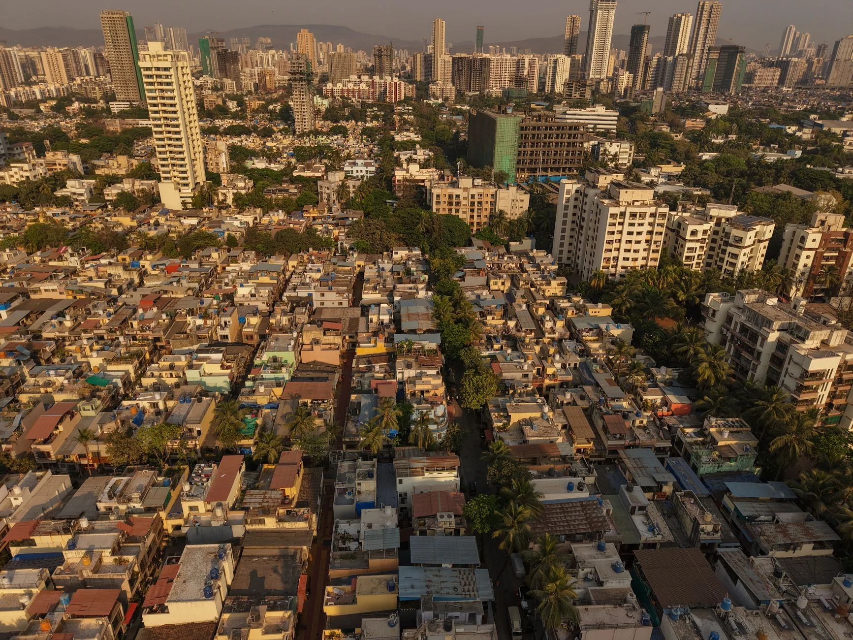Aerial panorama of Mumbai's diverse architecture showcasing urban skyscrapers and dense residential areas.