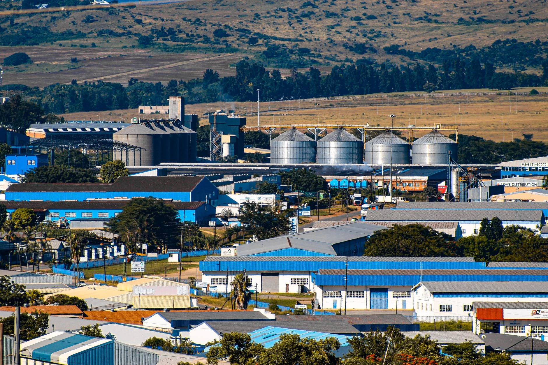 Aerial view of the industrial area in Matsapha, Eswatini, with factories and silos.
