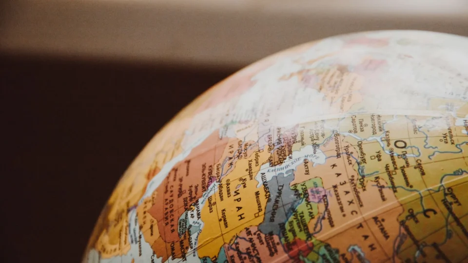 Detailed close-up of a globe showcasing parts of Europe and Asia for world exploration concepts.