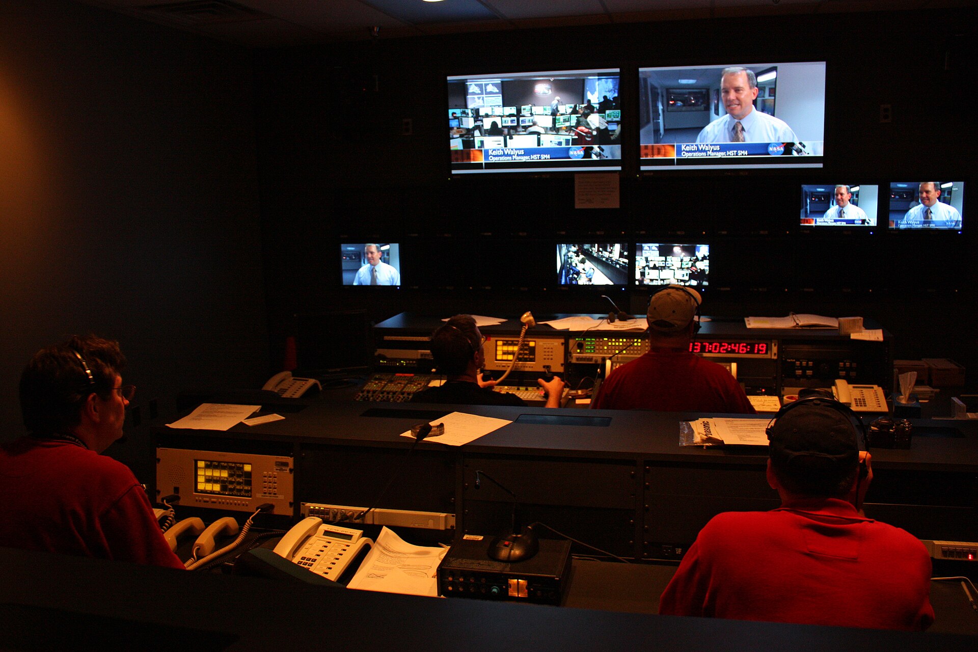 Producers operating a live television broadcast in a studio control room