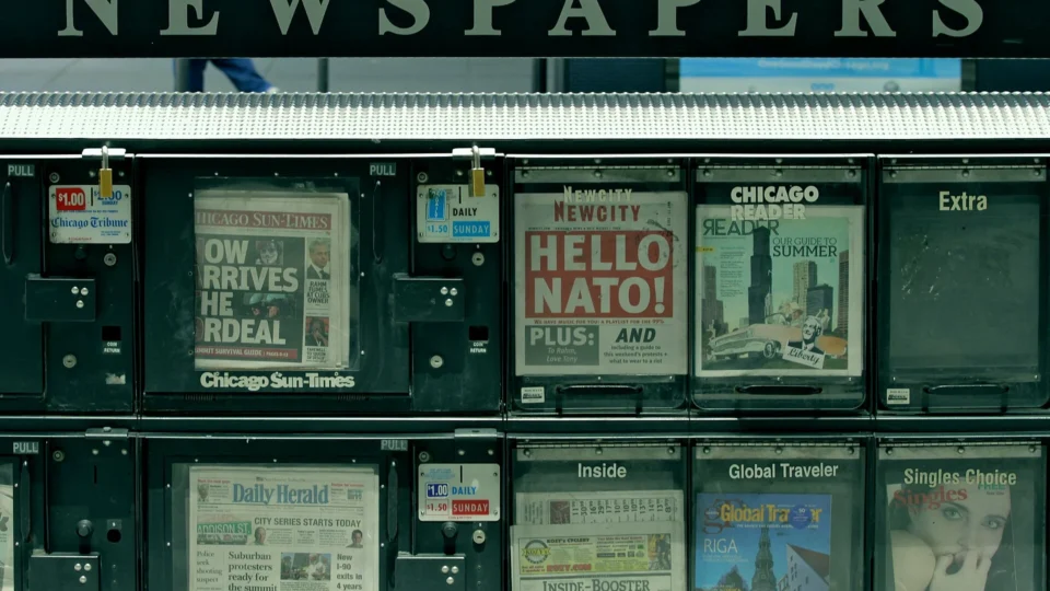Street newsstand stocked with newspapers and magazines
