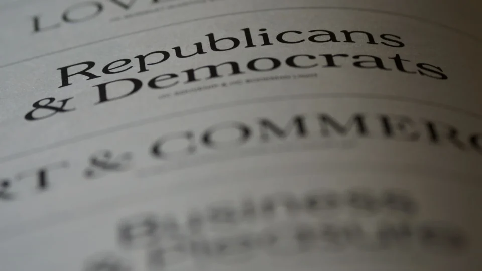 Close-up of blurred text page with 'Republicans & Democrats', focusing on political themes.
