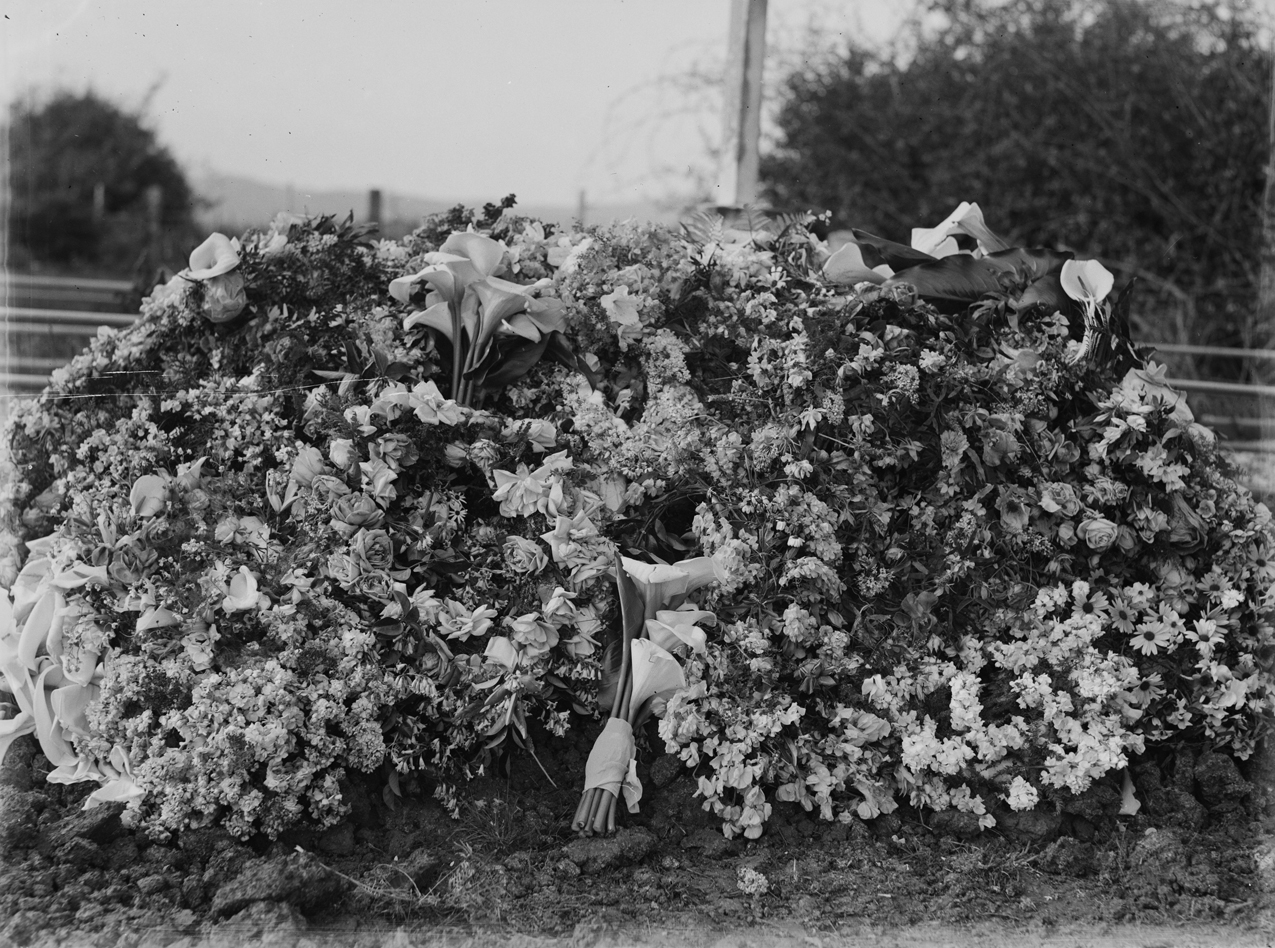 Funeral wreath of flowers at a graveside memorial