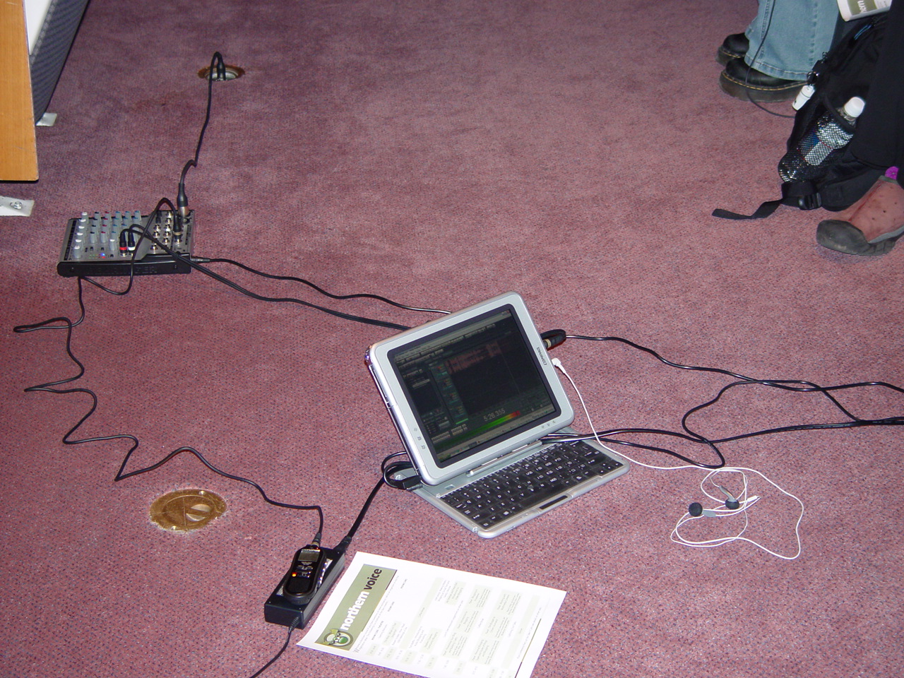 Podcast microphone and headphones on a recording desk