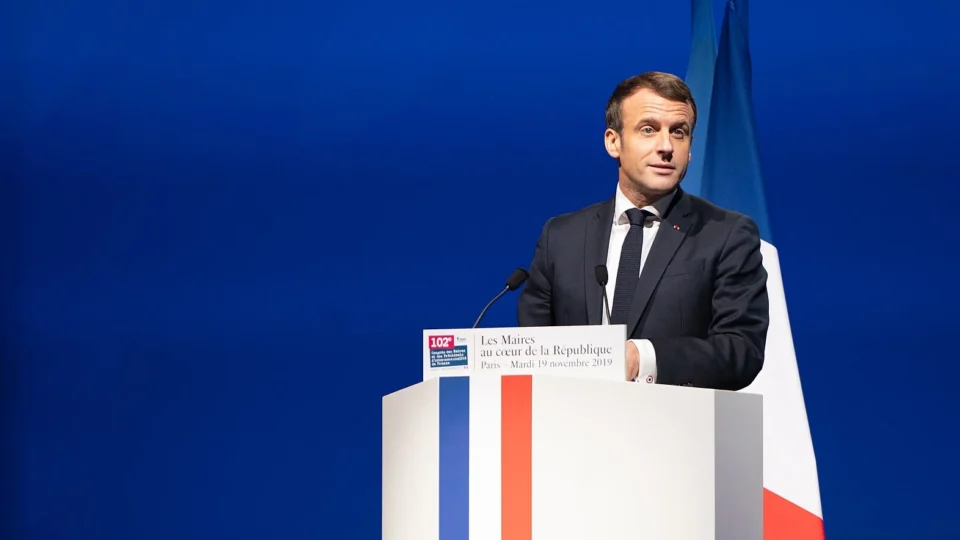 French President Emmanuel Macron speaking at a podium