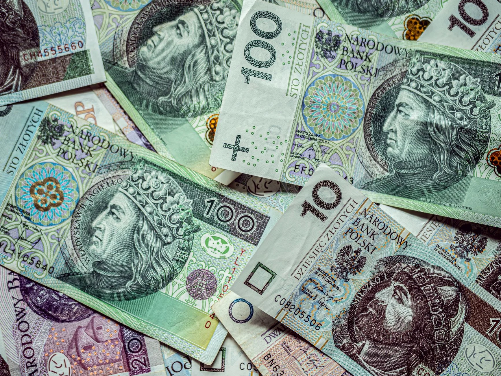 Close-up of various Polish Zloty banknotes, displaying currency and finance.
