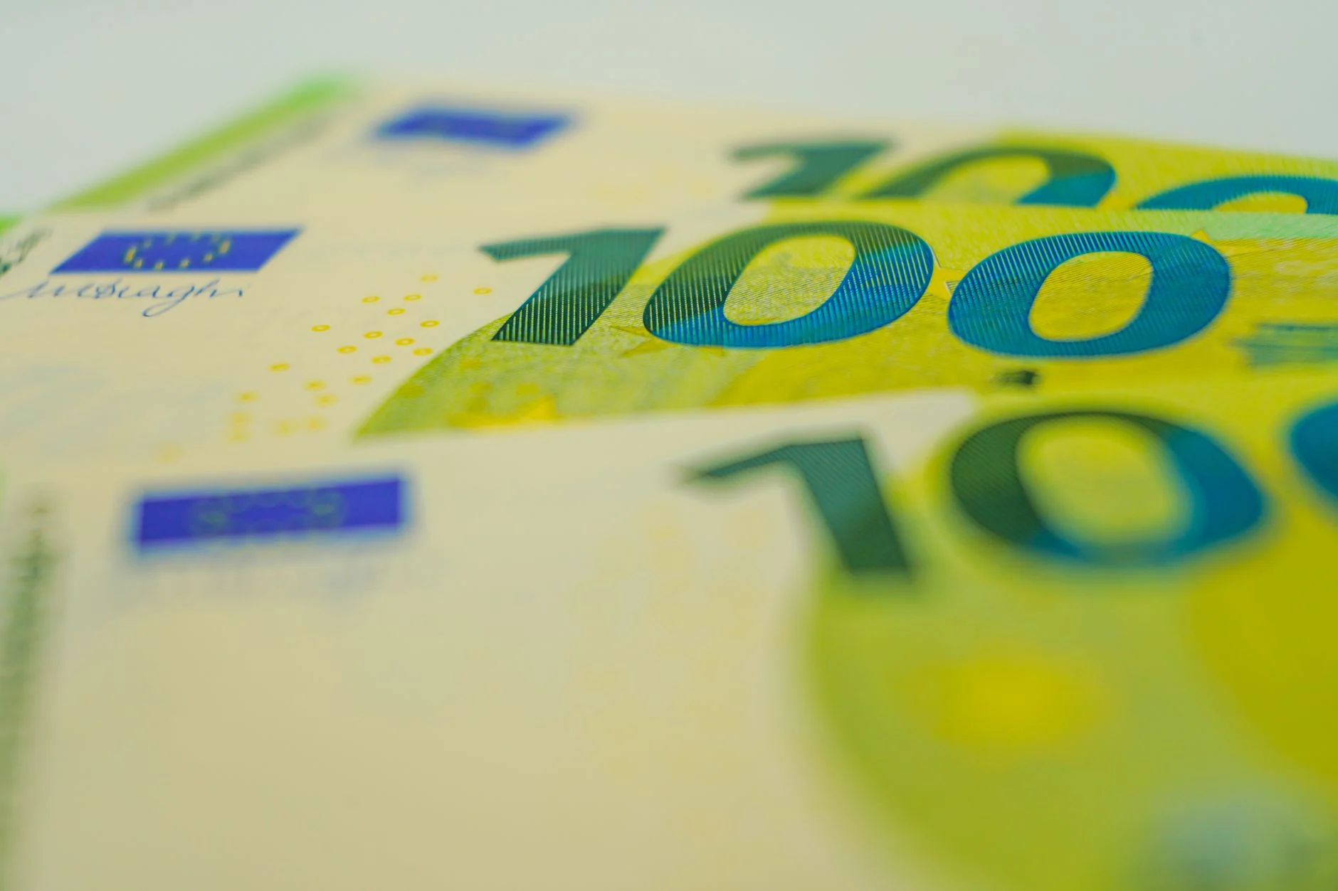 Euro banknotes in close-up with focus on 100 denomination. Perfect for financial themes.