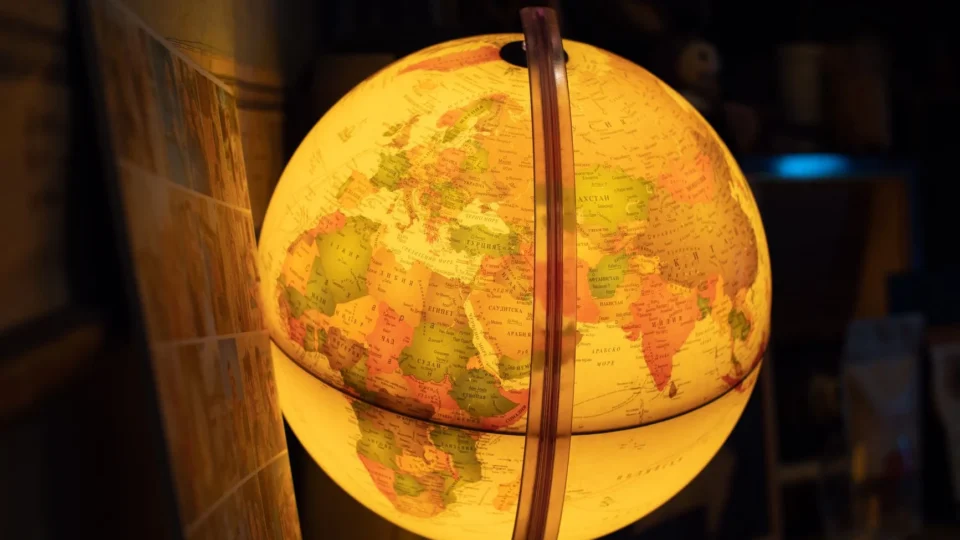 Close-up of a glowing world globe emphasizing geography and learning.