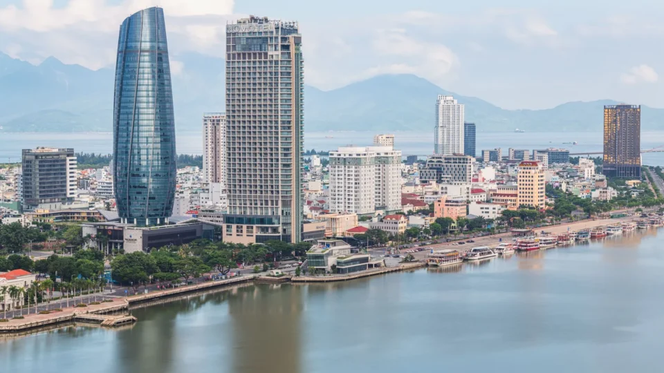 Stunning aerial view of Da Nang skyline with skyscrapers by the river. Perfect for travel and urban stock photos.