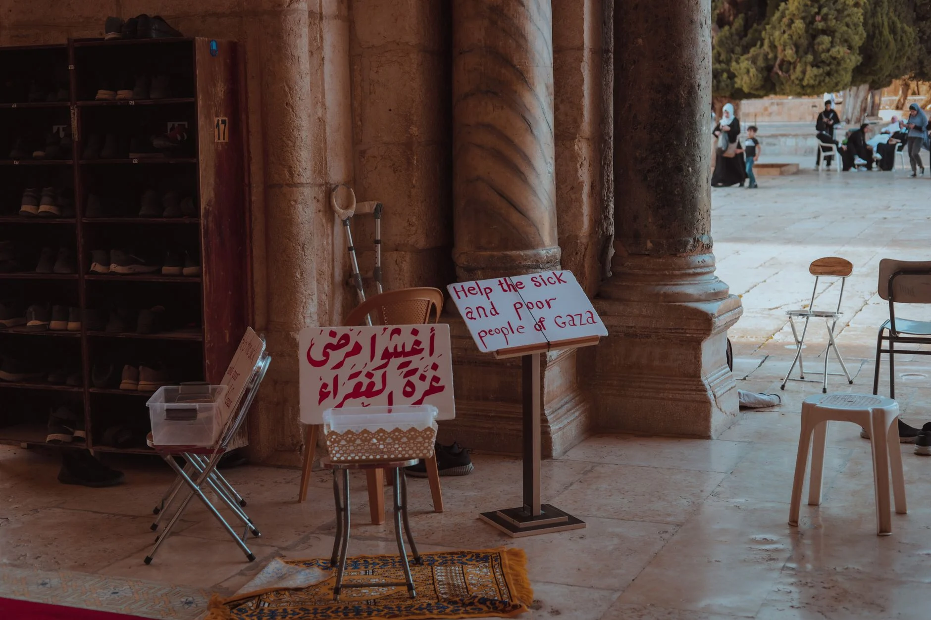 Signs for charity seeking help for Gaza at a historical site in Jerusalem.