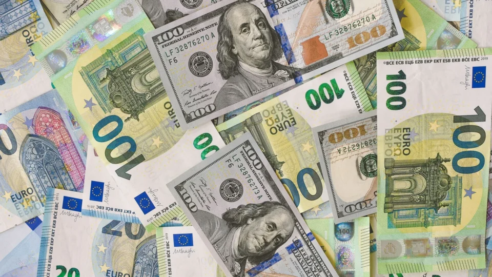 A detailed collage of Euro and Dollar banknotes showcasing international currency exchange.