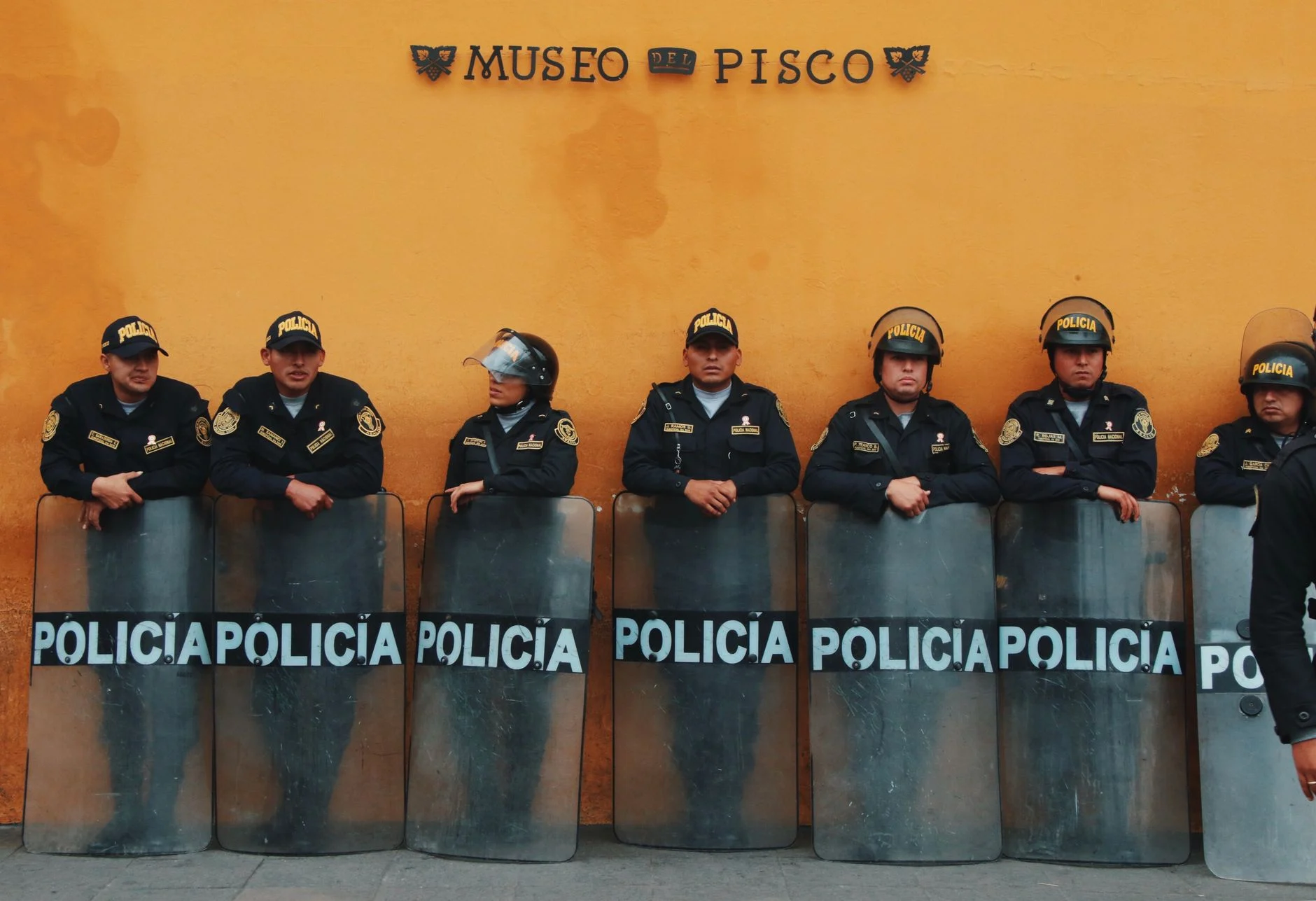 Peruvian police in uniform outside Museo del Pisco, Lima, Peru.