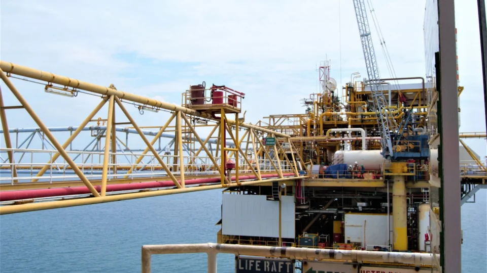 A detailed view of an offshore oil rig in Indonesian waters, highlighting industrial engineering.