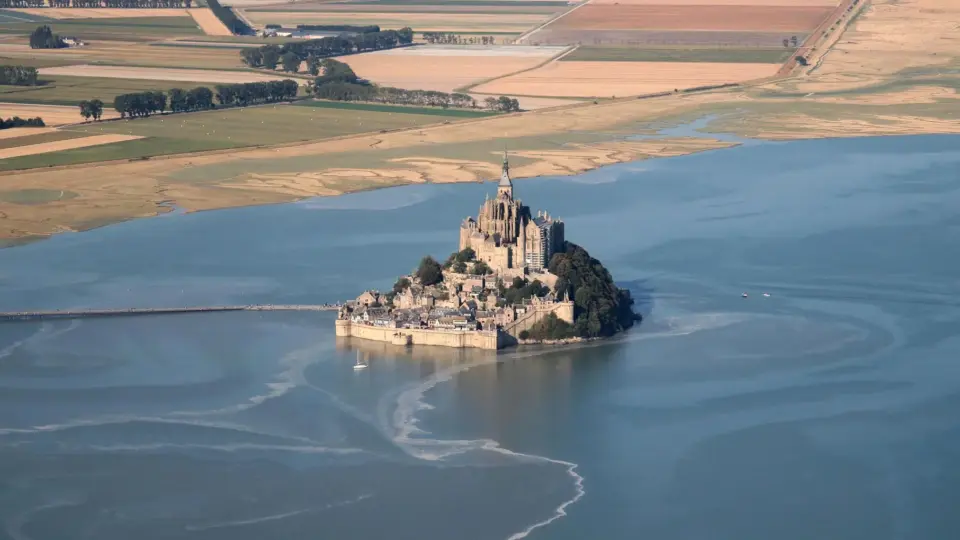 Stunning aerial view of Mont Saint-Michel in Normandie, a famous UNESCO World Heritage site.