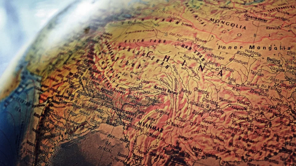 Explore the intricate details of China and neighboring regions in this vintage-style globe photo.