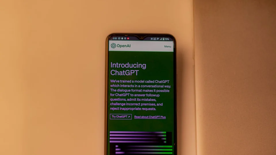 A smartphone showing the ChatGPT interface, emphasizing technology and AI indoors.
