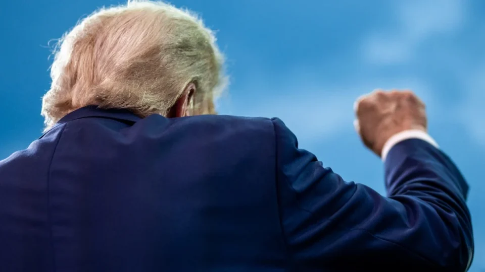 Donald Trump raises a fist at the U.S. Army parade in Washington