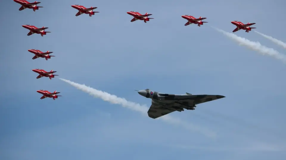 Impressive aerial display featuring the Red Arrows and a Vulcan bomber at the Fairford airshow.