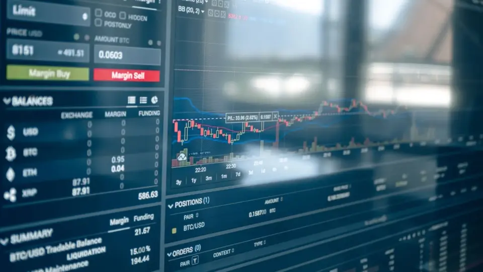 Close-up of a digital screen displaying stock trading graphs and cryptocurrency values. Ideal for finance and technology themes.