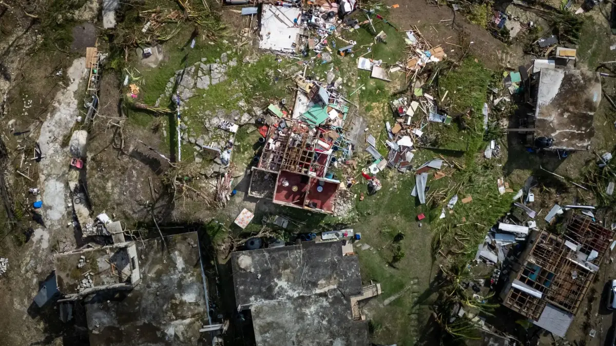 Aerial photograph showing severe structural damage after a hurricane.