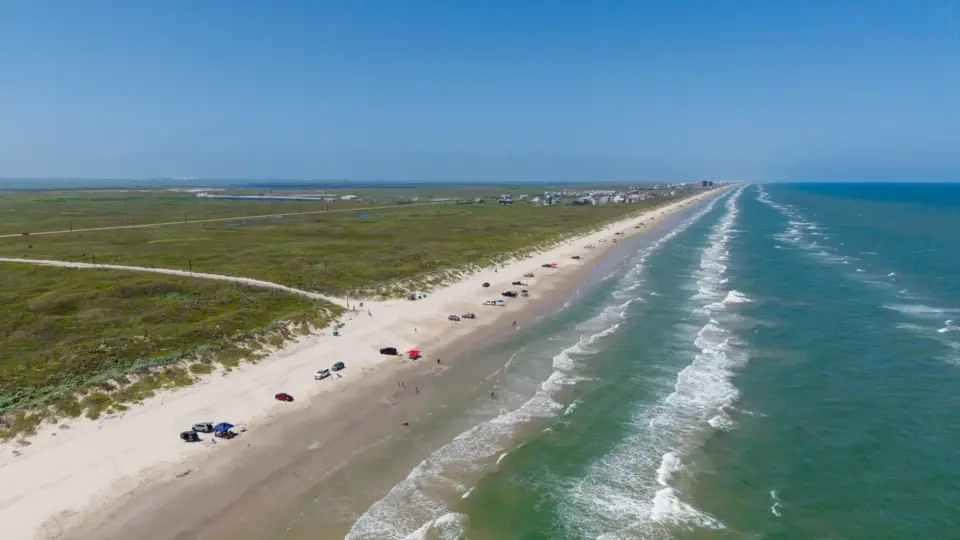A scenic aerial view of Corpus Christi's coastline showcasing the Gulf of Mexico and sandy beaches.