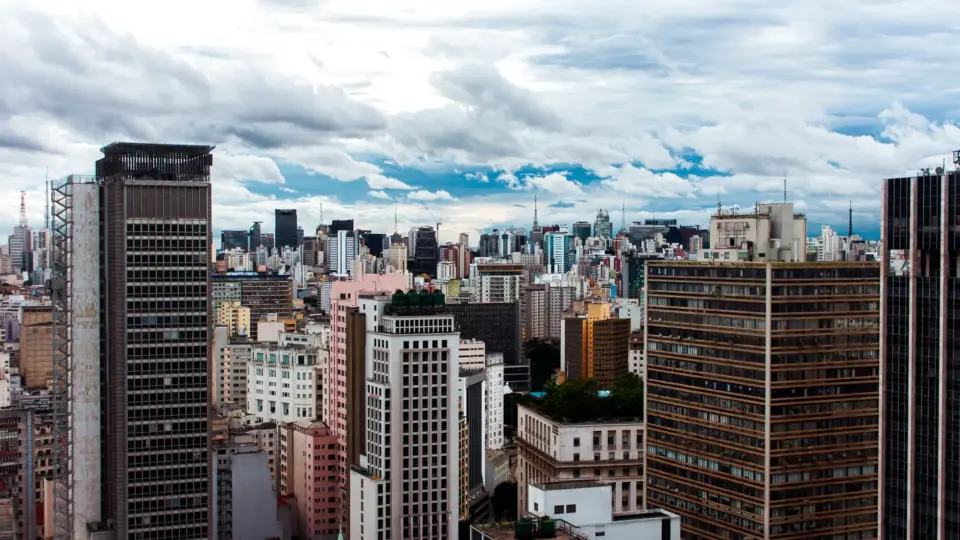 A striking view of São Paulo's skyline showcasing modern skyscrapers and urban landscape under a dramatic sky.